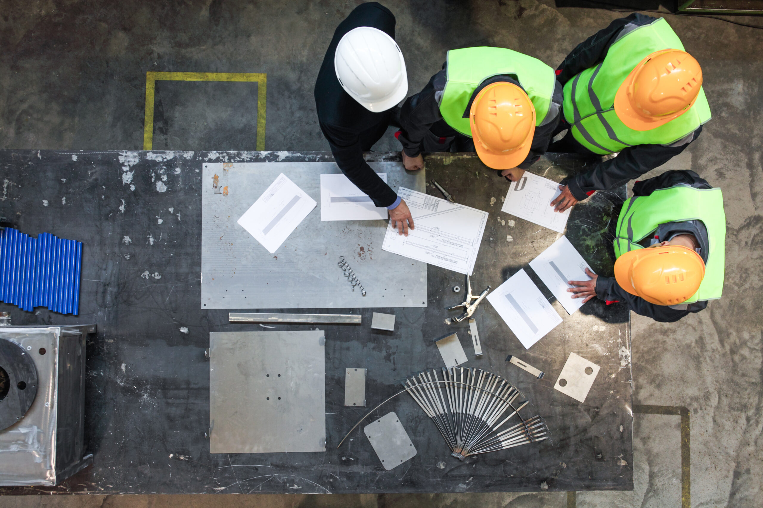 workers and manager working with documents